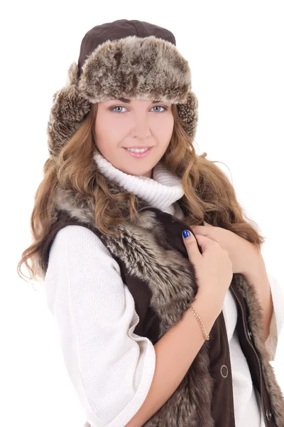 Young beautiful woman in fur hat and vest isolated on white — Stock Photo, Image