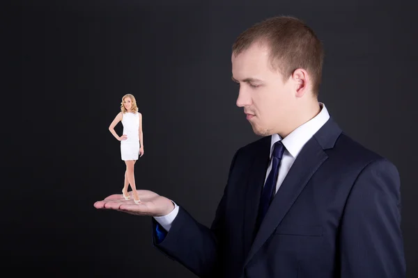 Business concept - man holding woman on his hand — Stock Photo, Image