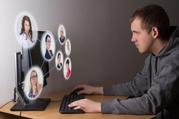 Social media concept - young man using a computer — Stock Photo, Image