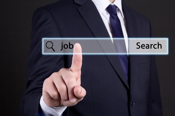 Man in business suit searching job in internet — Stock Photo, Image