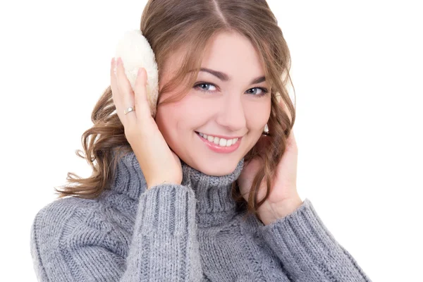 Happy attractive woman in woolen sweater and muffs isolated on w — Stock Photo, Image