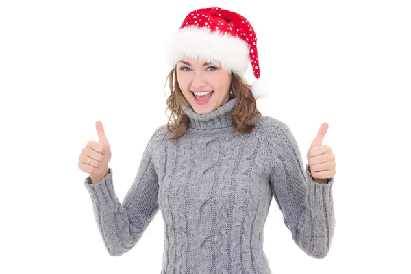 Jovem mulher bonita em roupas de inverno e santa hat polegares acima — Fotografia de Stock