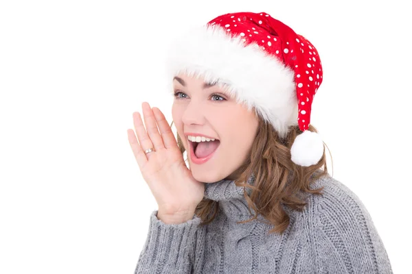 Jovem mulher bonita em roupas de inverno e gritando de chapéu de Papai Noel Imagens Royalty-Free