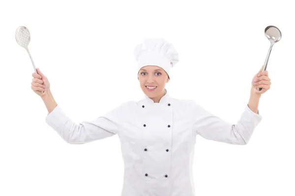 在持有金属勺子上 whi 孤立的厨师制服的年轻女子 — 图库照片