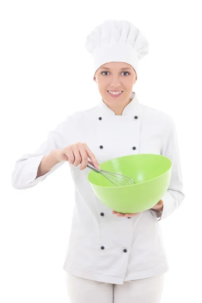 Jovem mulher com uniforme de chef mistura algo em bo plástico verde — Fotografia de Stock