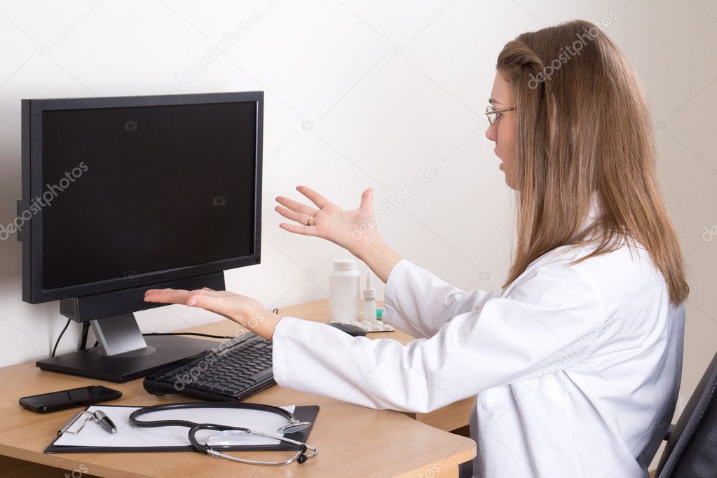 stressed young woman doctor in office