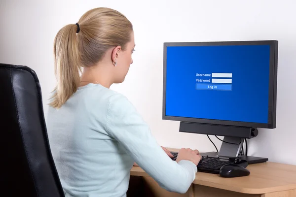 Back view of woman with personal computer using email or social — Stock Photo, Image