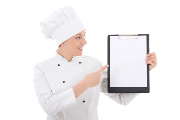 Young woman in chef uniform showing clipboard with blank paper i — Stock Photo, Image