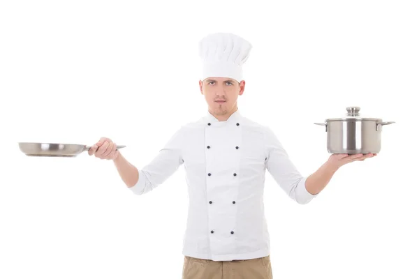 Young man in chef uniform holding saucepan and frying pan isolat — Stock Photo, Image