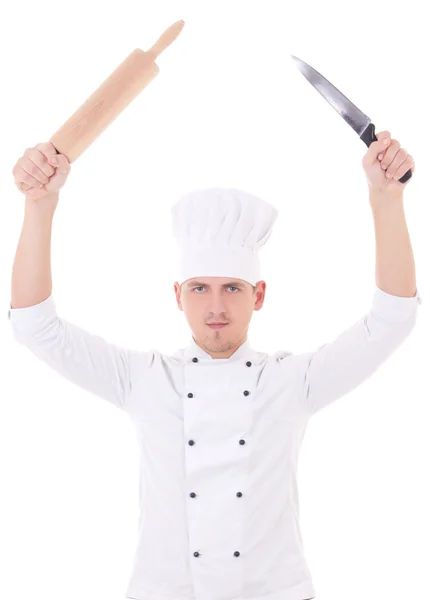 Young man in chef uniform holding roller pin and knife isolated — Stock Photo, Image