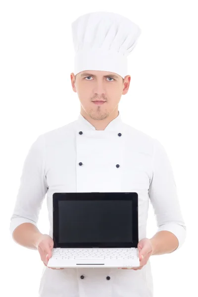 Young man in chef uniform holding laptop with blank screen isola — Stock Photo, Image