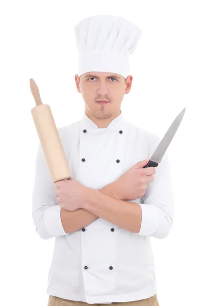 Young man in chef uniform with wooden baking rolling pin and kni — Stock Photo, Image