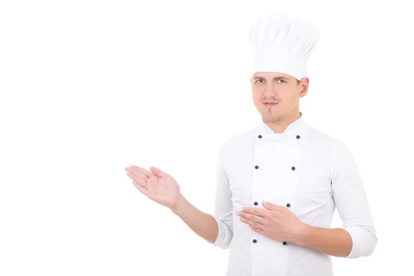 Young man chef showing or presenting something isolated over whi — Stok Foto