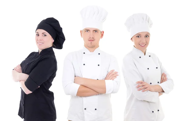 Vaření koncept - mladí kuchaři tým izolované na bílém — Stock fotografie