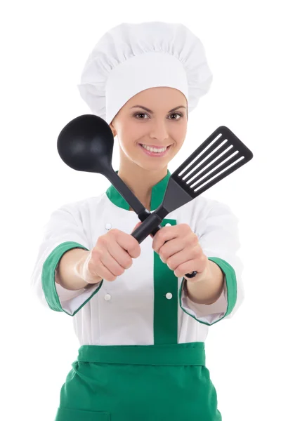 Vrouw in chef-kok uniform met keukengerei geïsoleerd op wit — Stockfoto