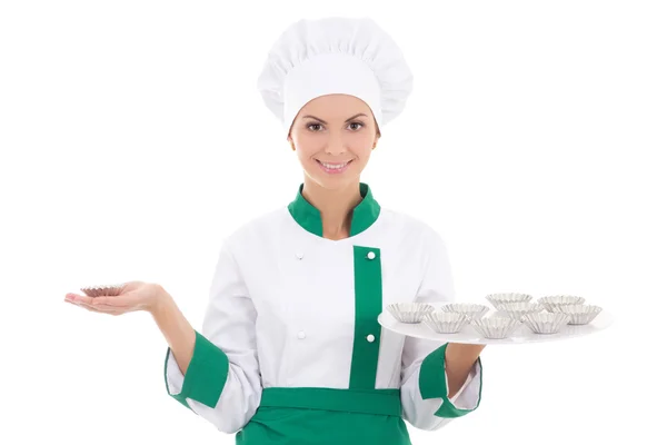 Young woman in chef uniform with metal muffin forms isolated on — Stock Photo, Image