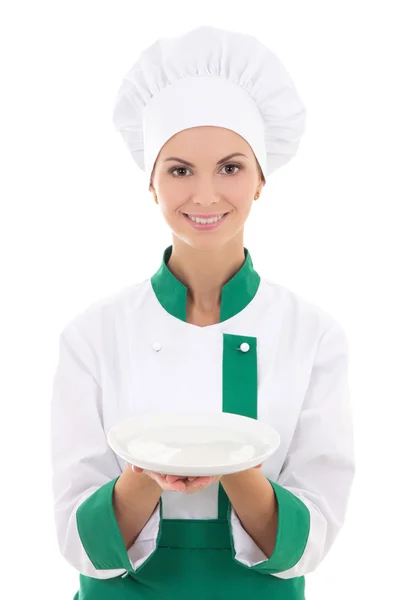 Jovem mulher atraente no chef uniforme com prato vazio isolado — Fotografia de Stock