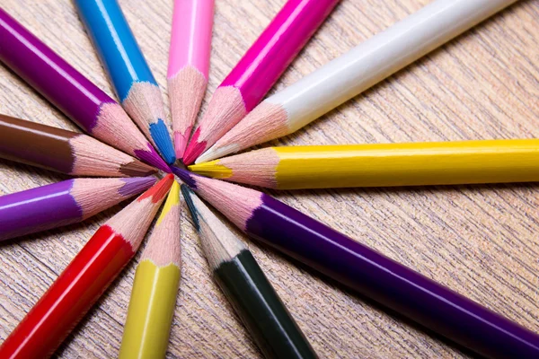 Colored drawing pencils on wooden table — Stock Photo, Image