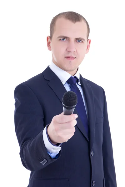 Jovem jornalista masculina com microfone tendo isolado — Fotografia de Stock