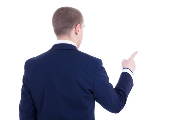 Back view of young business man pointing at something isolated o — Stock Photo, Image
