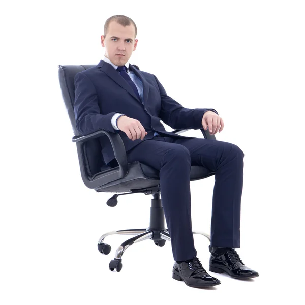 Hombre de negocios joven sentado en silla de oficina aislada en blanco — Foto de Stock