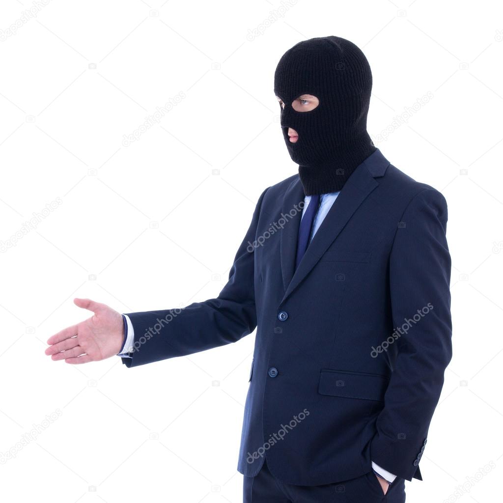 corruption concept - man in business suit and black mask with ha