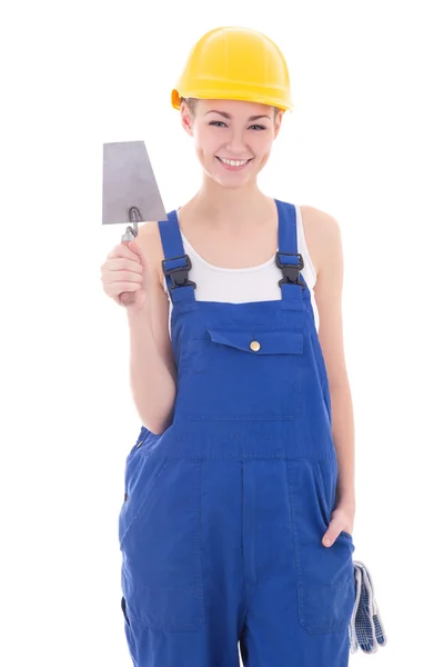 Construtor de jovem mulher bonita no macacão azul com espátula isol — Fotografia de Stock