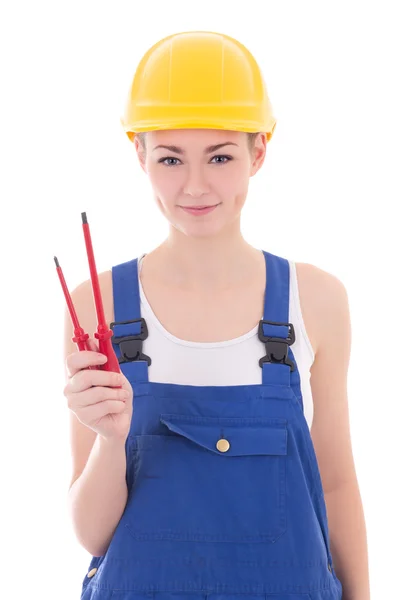 Construtor de jovem mulher bonita no macacão azul com chave de fenda — Fotografia de Stock