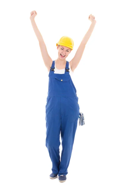 Happy woman builder in blue coveralls with hands up isolated on — Stock Photo, Image