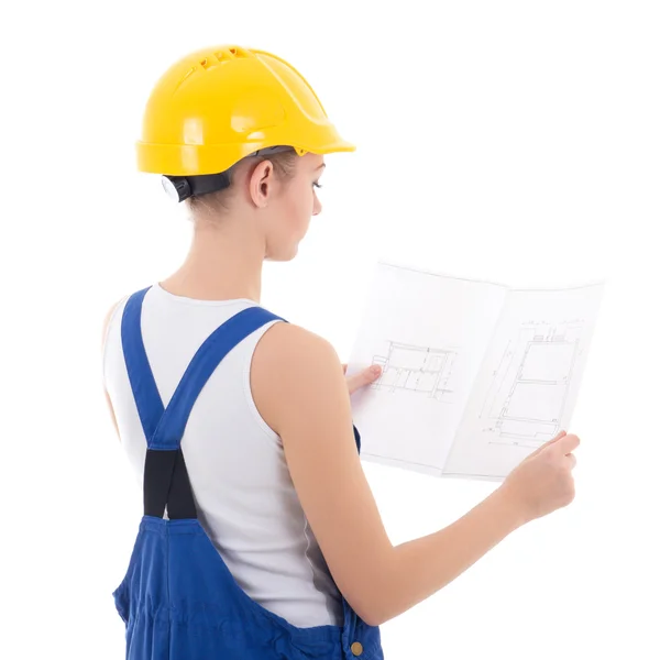 Back view of woman builder in blue coveralls with scheme isolate — Stock Photo, Image