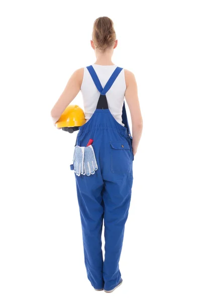 Rear view of young attractive woman builder in blue workwear  is — Stock Photo, Image