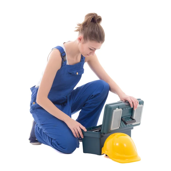 Constructor de jóvenes atractiva mujer en ropa de trabajo azul con caja de herramientas iso —  Fotos de Stock