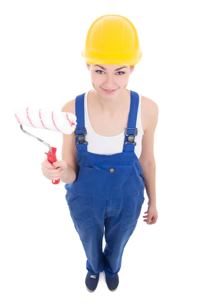 Constructor de jóvenes atractiva mujer en ropa de trabajo con rodillo paintbrus —  Fotos de Stock