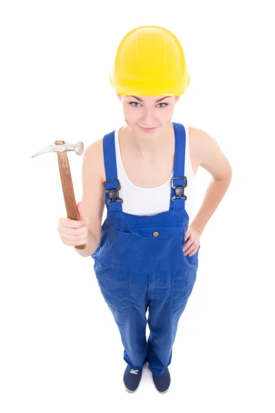 Construtor de mulher jovem atraente no workwear com martelo isolado — Fotografia de Stock