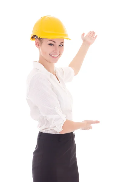 Happy business woman architect in yellow builder helmet pointing — Stock Photo, Image