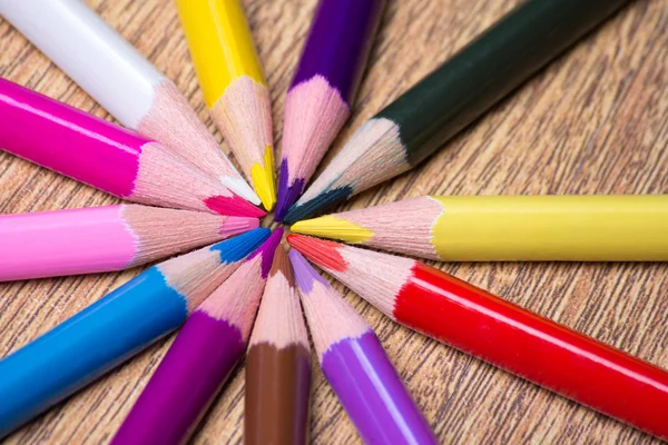 Colorful drawing pencils on wooden table — Stock Photo, Image