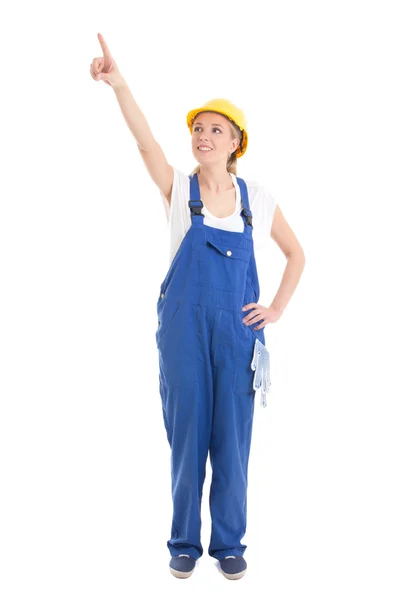 Mujer en uniforme de constructor señalando algo aislado en blanco —  Fotos de Stock