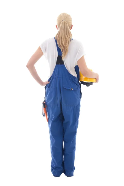 Back view of happy woman in blue builder uniform holding yellow — Stock Photo, Image