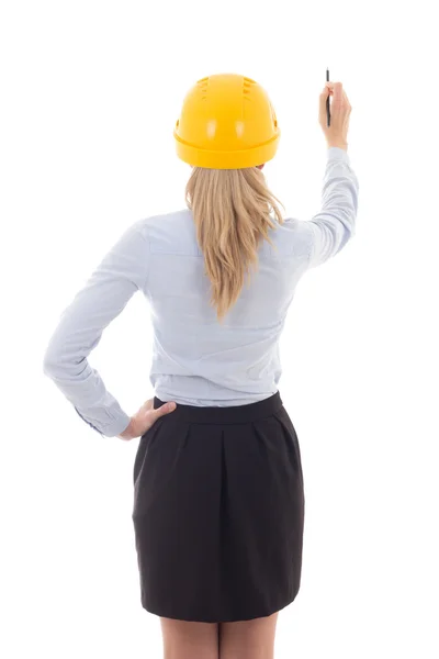 Vista posterior de la mujer de negocios en el casco de constructor escribir algo — Foto de Stock