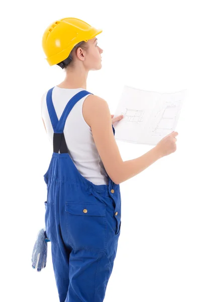 Back view of woman builder in blue coveralls with building schem — Stock Photo, Image