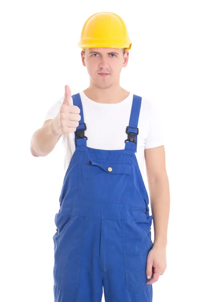 Jovem bonito no Construtor azul uniforme sentido positivo isolado na — Fotografia de Stock