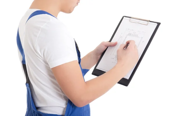 Close up of man builder in blue uniform writing something on blu — Stock Photo, Image