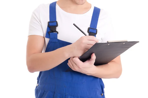 Close up of man builder in blue uniform writing something in cli — Stock Photo, Image