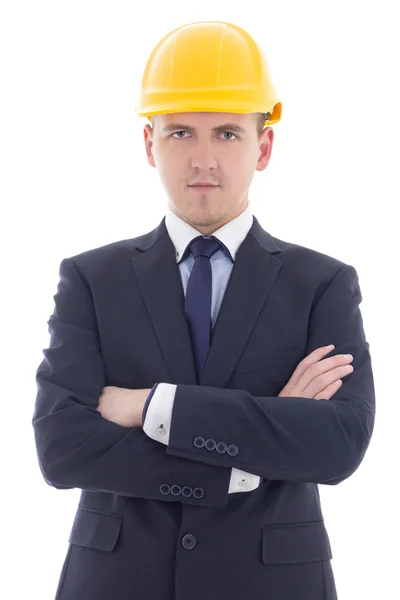 Hombre de negocios guapo joven en casco de constructor amarillo aislado — Foto de Stock