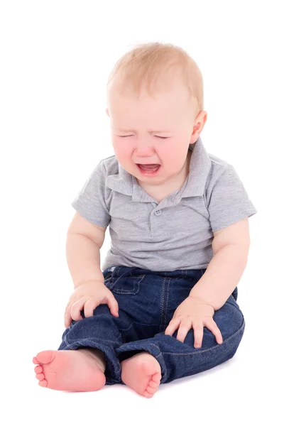 Niño llorando sentado aislados en blanco — Foto de Stock