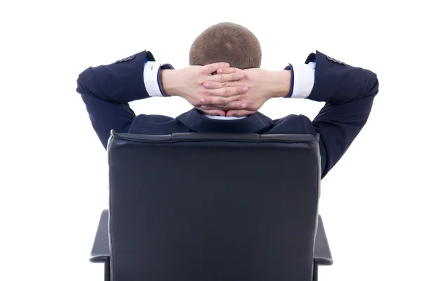 Vista posterior de hombre de negocios sentado en la silla de la oficina aislada en wh —  Fotos de Stock