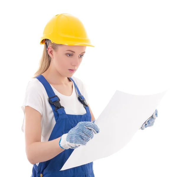 Jonge vrouw in blauwe bouwer uniform met de bouw van plan geïsoleerd — Stockfoto