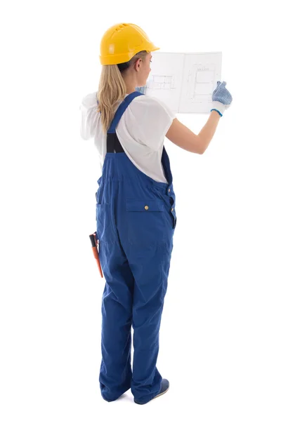 Achteraanzicht van vrouw in blauwe bouwer uniforme bedrijf Bouwtekening — Stockfoto