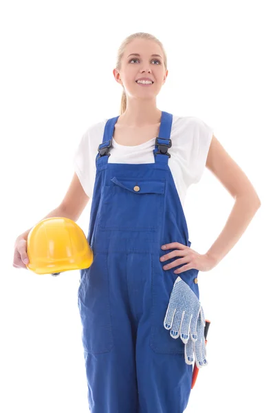 Dreaming woman in blue builder uniform holding yellow helmet iso — Stock Photo, Image