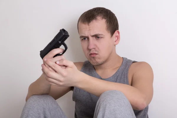 Suicide concept - stressed man with gun — Stock Photo, Image